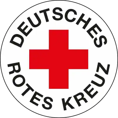 Rundes Logo des Deutschen Roten Kreuzes mit rotem Kreuz auf weißem Hintergrund und schwarzer Schrift „Deutsches Rotes Kreuz